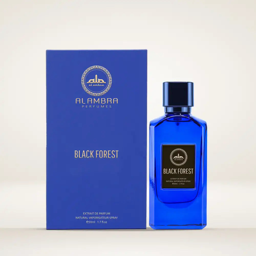 The Al Ambra Perfumes Black Forest Extrait de Parfum set, featuring the cobalt blue rectangular bottle next to its matching blue box. The bottle and box both display the Al Ambra logo and "BLACK FOREST" title in gold and white text, specifying the 50ml / 1.7 Fl.oz. size